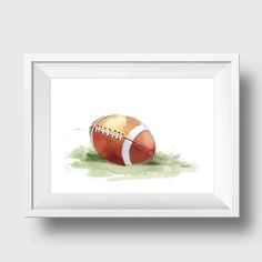 a watercolor painting of an orange and white football on the ground with green grass