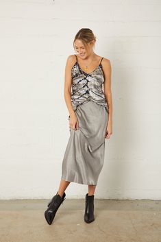 Bias v-neck cami with adjustable straps in our Ecovero Cersei Textured Satin makes for a flattering tank that is ready to party when you are! Pair with our satin Ariel Bias skirt or our Satin Kickback Pant for laid back glamour. Machine wash warm with like colors, tumble dry low Adjustable spaghetti straps 100% Ecovero Cersei Textured Satin Bias cut for flattering fit Sophia (model) is wearing size Small/4 and is 5'9", 32C Bust, 26" Waist, and 36" Hips Bias Skirt, Twill Skirt, Beautiful Prints, Cropped Denim Jacket, Satin Skirt, Cropped Denim, Effortless Style, Soft Fabric, Soft Fabrics