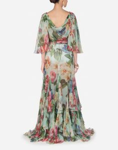 This luxury Chiffon Floral-Silk Flutter-Sleeve Gown by Dolce & Gabbana is hand-painted with a delicate floral print. Crafted from lightweight chiffon, dress epitomizes the elegance, glamour, and passion of Mediterranean. Make an unforgettable entrance at your next special event refined sensual look. Elegant Multicolor Silk Chiffon Dress, Elegant Multicolor Silk Gown, Elegant Evening Dresses Long, Floral Print Chiffon Dress, Elegant Evening Dresses, Green Outfits, Floral Print Dress Long, Women Fashion Casual, 40 Women