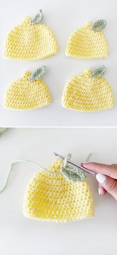 the crocheted hat is being worked on by someone using scissors to cut it