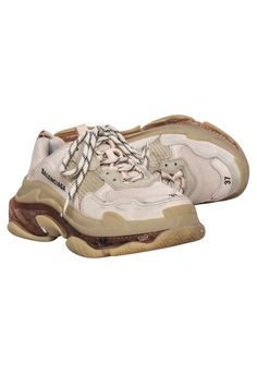 Fashionistas, feast your eyes on Balenciaga's Triple S sneakers--the ultimate street style accessory! Bicolored laces, triple stacked soles, and color blocked neutrals make these chunky fly-kicks a must-have for looking and feeling your best. Style these trendy sneakers with raw hem jeans and a neutral crop top. Size 7 (37) Double foam and mesh Leather free Bicolor laces Embroidered logo on side Embossed logo on back Triple S rubber branding on the tongue Oblong heel platform Discoloration on toes Cushioned Lace-up Chunky Mesh Sneakers, Sporty Beige Platform Sneakers, Sporty Beige Platform Sneakers With Laces, Chunky Lace-up Sneakers With Textured Sole, Trendy Beige Sneakers With Rubber Sole, Beige Lace-up Chunky Sneakers, Beige Low-top Sneakers With Studded Rubber Outsoles, Beige Low-top Chunky Sneakers With Laces, Beige High-top Chunky Sneakers With Laces