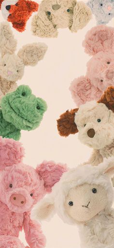 there are many different stuffed animals in the same circle together on this white background with pink, green, red, and blue colors