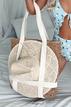 70% PAPER, 30% POLYESTER Color: Tan/Dark Khaki Braided Straw Tote Canvas Straps Can Hold A Wide Brim/Fedora Style Hat On Front Zipper Closure Lined Inner Slip Pocket Dimensions: 18" W x 19" H x 3.5" D Launched: 2/27/24 Beachy Beige Straw Hat For Beach Season, Beachwear Beige Straw Hat For Beach Season, Beachwear Straw Hat For Beach Season In Beige, Beige Straw Hat For Beach Season, Beige Straw Hat For Beach Vacation, Beige Straw Hat For Vacation Beachwear, Beige Beachwear Straw Hat For Vacation, Beige Summer Sun Hat For Poolside, Beige Straw Hat For Vacation