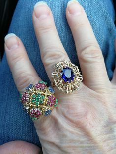 "Beautiful, unique, outrageous vintage18K multi stone ring. There is no karat stamp, but has been tested as 18K. It weighs 14.8 grams, and is set with the following approximate weights of stones: .30 ctw genuine emeralds, .59 ctw genuine sapphires, and .70 ctw genuine rubies. It is between a size 7 1/2 and 8. It has \"bumps\" inside the ring which leave a small gap, when measuring it in a mandrel. There is one flaw in the ring. There is a missing emerald, due to a broken prong. I have this area Oval Multi-stone Gemstones For Collectors, Vintage Multi-stone Oval Sapphire Ring, Vintage Oval Multi-stone Sapphire Ring, Multicolor Heirloom Rings For Formal Occasions, Heirloom Multicolor Rings For Formal Occasions, Heirloom Multicolor Rings For Formal Events, Collectible Multi-stone Emerald Ring, Gold Multi-stone Cluster Ring Collectible, Unique Jeweled Anniversary Ring