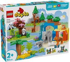 the lego duplo set is packed with animals, trees and other things in it