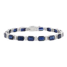 Blue Sapphire and Diamond bracelet in 18K Gold. It has a perfect octagon cut gemstone to make you stand out on any occasion or an event. A tennis bracelet is an essential piece of jewelry when it comes to your wedding day. The sleek and elegant style complements the attire beautifully, whether it's the bride wearing it herself, or as a gift to her bridesmaids to wear on the D’day.  Bracelets are worn to enhance the look. Women love to look good. It is common to see a woman rocking a lovely gold bracelet on her wrist. A gold gemstone bracelet is the ultimate statement piece for every stylish woman.  PRODUCT DETAILS :-  > Material - 18K Solid White Gold > Gemstone - Blue Sapphire  > Stone Weight - 17.85 ct > Stone Shape - Octagon  > Stone Pcs - 17  > Stone Size - 7 x 5 mm > Diamond Weight - Classic Sapphire Bracelets For Formal Occasions, Classic Diamond Gemstone Bracelet For Formal Occasions, Classic Gemstone Diamond Bracelet For Formal Occasions, Classic Diamond Bracelet With Gemstone For Formal Occasions, Classic Formal Diamond Bracelet With Gemstone, Formal Bracelets With Emerald Cut Gemstones, Blue Diamond Cut Bracelet For Formal Occasions, Luxury Sapphire Tennis Bracelet For Formal Occasions, Classic Blue Diamond Bracelet For Wedding