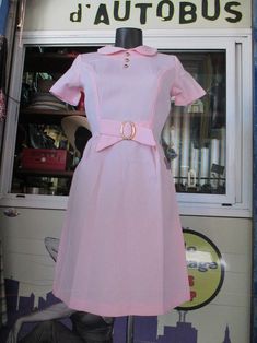 "Amazing deadstock Mods dress. Pale pink coloured with a cute peter pan collar. Close-fitting at bust and flared bottom. It has a preety bow with golden buckle up to the front waistline (pic. 5). Three small spherical golden buttons decorate the collar (pic. 4). Short sleeves. Long back zipper (pic. 8) There's a flaw on the back lower seam (pic. 9) and a small spot on front right hip (pic. 10), but, believe me, you can hardly notice them. Peculiar wrinkled fabric, as you can see in pics, but the Pink Retro Dress With Peter Pan Collar, 60s Twiggy, Wrinkled Fabric, Clothes Flower, Twiggy Fashion, Dress Peter Pan Collar, Hippie Jeans, Flower Power Hippie, Pale Pink Dress