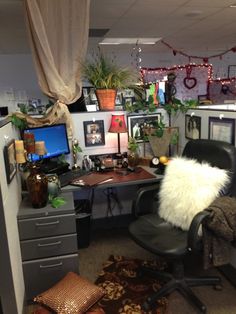 an office decorated for christmas with pictures and plants