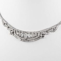 For Sale on 1stDibs - Stunning vintage Art Deco style diamond high jewelry necklace, centered with a marques diamonds. Approximately 10.80 carats of round, marquess, and baguette Platinum Baguette Cut Diamond Necklace For Wedding, Baguette Cut Platinum Diamond Necklace For Wedding, Baguette Cut Diamond Necklace In Platinum For Wedding, Formal Art Deco Diamond Necklace With Accents, Vintage Platinum Diamond Necklace For Wedding, Art Deco Brilliant Cut Necklace For Wedding, Art Deco Wedding Necklace With Brilliant Cut, Art Deco Diamond Necklace With Diamond Accents, Vintage Baguette Diamond Jewelry