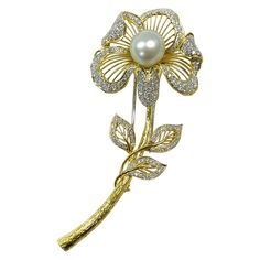 18 Karat Yellow and White Gold Diamond Pearl Flower Brooch. The brooch features an 11.5mm South Sea pearl and 171 round brilliant-cut diamonds. The pearl has good luster with hues of pink and blue. The diamonds adorn the surround of the flower petals, the upper stem, and the surround of the leaves. The diamonds are pave/bead-set in white gold for added contrast. The diamonds measure 1.72mm for a total carat weight of 3.42ctw. The diamonds are VS1-VS2 in clarity (G.I.A.) and G-H in color (G.I.A.). The brooch measures 3.45 x 1.47". There are lovely details on this brooch with a highly textured stem and meticulous milgrain on the flower petals and leaves. Stamped on the side of the brooch near plunger is K18. The closure both a c-hook and a pin and plunger closure. The brooch/pin has a gold w Pave Beads, Bead Set, Sea Pearl, Sea Pearls, South Sea Pearls, Pearl Flower, The Pearl, Gold Flowers, Flower Brooch