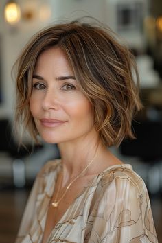 A woman with a soft layered bob featuring honeyed highlights and gentle waves. Bob Messy Hair, Short Layered Bob Curtain Bangs, Brown Bobs Haircuts, Short Layered Bob Hairstyles For Thick Hair, Layered Hair Bob, Soft Layered Bob, Layered Bob Cut, Bob With Undercut, Bob With Layers