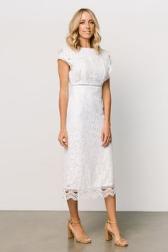 Get yourself a classy lace midi dress. Our Nessa Lace Midi Dress has cute ruffles and a round neckline! Feminine Midi Dress With Lace Trim For Formal Events, Feminine Lace Trim Midi Dress For Formal Events, Feminine Fitted Cap Sleeve Dress, Feminine Fitted Dress With Scalloped Edges, Fitted Feminine Dresses With Scalloped Edges, Feminine Formal Midi Dress With Scalloped Lace, Party Dress With Scalloped Edges And Short Sleeves, Elegant Evening Dresses With Scalloped Edges, Feminine Cap Sleeve Dresses For Spring