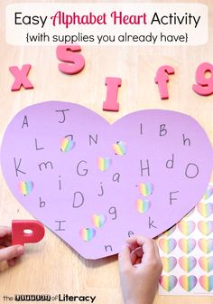 someone is making a heart shape with letters and numbers