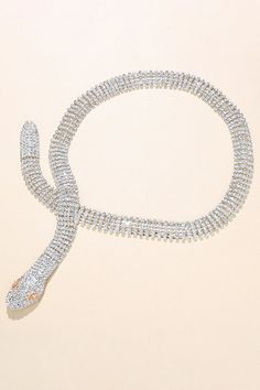 Adorn yourself with a serpent-shaped water diamond necklace, an embodiment of timeless allure. Crafted with intricate detail to enhance your elegance, perfect for adding a touch of sophistication to any ensemble. Elegant Snake Shape Necklaces With Clavicle Chain, Elegant Snake-shaped Jewelry With Diamond Accents, Elegant Snake Clavicle Chain Necklaces, Elegant Snake Shape Necklace For Party, Elegant Snake Shaped Metal Jewelry, Elegant Clavicle Chain Necklace With Snake Shape, Elegant Snake-shaped Metal Jewelry, Silver Snake Necklace For Party, Formal Snake-shaped Diamond Jewelry