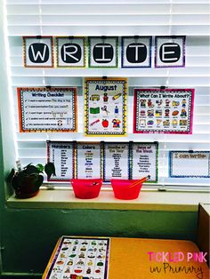 the word work is displayed in front of a window with two red buckets on it