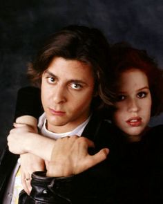 the young man and woman are posing together