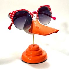 "Animal eyeglass stands from ArtAkimbo - Here's a stylish bit of waterfowl to brighten your decor whilst keeping your spectacles handy. Cast in sturdy, polished urethane, colored throughout. This little splash of room jewelry stands about 6\" tall. Glasses not included" Modern Glass Sunglasses As Gift, Retro Sunglasses With Tinted Lenses As Gift, Retro Sunglasses With Tinted Lenses As A Gift, Novelty Sunglasses With Uv Protection For Gift, Novelty Sunglasses With Tinted Lenses As Gift, Retro Sunglasses With Tinted Lenses For Gift, Novelty Sunglasses With Tinted Lenses For Gift, Novelty Sunglasses With Uv Protection As Gift, Sunglasses Stand Aesthetic