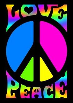 a peace sign with the word love written on it in purple, blue and green