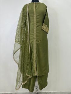 Indian Wedding Wear Salwar Kameez / Indian Ethnic Dress / Plus Size Silk Kurta Dress Traditional Indian Wear / Salwar Kameez Dupatta / Kurti Palazzo Set / Party Wear/ Silk Kurta Set ITEMS DETAILS:- Olive Green Sequinned design Kurta with Trouser and Dupatta Kurta design: * Sequinned Work  * Straight shape * Regular style * Band Neck  * Three-quarter regular sleeves * Calf length with straight hem * Silk blend woven fabric Palazzos design:  * Solid Trousers 1 Pocket  * Partially elasticated waistband * Slip-on closure Dupatta length: 2 metres (approx.)  Top fabric: Silk Blend Bottom fabric: Silk Blend Dupatta fabric: Net Hand Wash NOTE:- please see the size chart in the image to choose a perfect size. Please feel free to ask any question regarding this item. WE ALSO ACCEPT CUSTOMISATION AS Festive Semi-stitched Straight Kurta Salwar Kameez, Pista Green Semi-stitched Suit For Diwali, Party Traditional Wear With Dabka On Cotton Silk, Party Traditional Wear In Cotton Silk With Dabka, Festive Cotton Silk Palazzo Set For Party, Fitted Cotton Silk Palazzo Set For Party, Party Kurta With Dabka On Chanderi Fabric, Anarkali Shantoon Kurta With Resham Embroidery, Elegant Green Shantoon Kurta