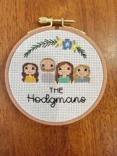 a cross - stitch hoop with the words, the hologianus on it