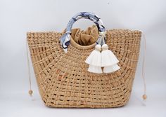 Large beach bag, bridesmaid beach gifts, straw beach bag for women Straw  Tote Bag is 100% handcrafted by local Thailand artists from a water hyacinth. The work is exquisite and of a very high quality. Our collection is handmade by artisans thailand. Variation in shading , weave, and size add to beauty and characteristics of each piece  Detail++ Material: 100% water hyacinth Closure: 100% cotton cream lining Approx size : Wide 5 inches Length 12 inches  (Top length of bag 16 inches) Height 11 in White Woven Handheld Straw Bag, White Handheld Woven Straw Bag, Elegant Crochet Bag With Bamboo Handle For Vacation, Handheld White Woven Straw Bag, Summer Beach Bag Gift, White Handheld Straw Bag With Braided Handles, Natural Color Beach Season Bags For Gift, Eco-friendly Handheld Straw Beach Bag, Jute Straw Bag With Bamboo Handle For Beach Season