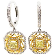 For sale is a lovely pair of Fancy Yellow Radiant Cut and White Diamond Dangle Earrings crafted out of 18K White and Yellow Gold! Each earring centers one radiant cut fancy yellow diamond with SI1 Clarity, weighing a combined total of 0.86 carats. 1) Radiant Cut measures 4.36 x 4.26 mm and 1) Radiant Cut measures 4.33 x 4.27 mm. Interspersed through the earrings are 138 Round Brilliant Cut diamonds, having H Color Grade and SI1 Clarity Grade. The combined total weight is 0.81 carats. The diamond White Diamond Dangle Earrings, Fancy Yellow Diamond, Diamond Dangle Earrings, Radiant Cut Diamond, Earring Crafts, Radiant Cut, Women Diamond, Lovely Jewellery, Yellow Diamond