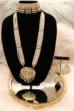 Handcrafted with love to give a real traditional look for this set beautifully studded with jadau stones and pearls give a royal look. Includes: Choker, Rani Haar, Earrings, and Tikka Rani Set Gold, Jadau Rani Haar, Rani Haar Gold Design, Diwali Chandbali Pearl Necklace With Intricate Design, Elegant Kundan Bridal Sets For Eid, Elegant Meenakari Bridal Sets For Eid, Elegant Hand Set Traditional Wear For Diwali, Hand Set Chandbali Pearl Necklace For Diwali, Traditional Gold Plated Jewelry Sets With Stone Work