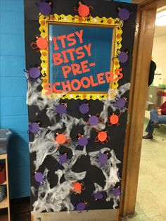 a classroom door decorated with halloween decorations