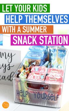 a plastic container filled with snacks next to a sign that says let your kids help themselves with a summer snack station