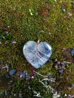 "Handmade copper wire wrapped Black Rutilated Quartz crystal heart pendant necklace. This black rutilated quartz crystal heart is wrapped in a minimalist style with bare copper wire. I love this style for it's simplicity and humanistic design as it depicts a heart inside a rib cage. This is the perfect gift to show love and appreciation to a loved one or yourself! You can choose between four different chain or cord options - 1 mm cotton cord, 2 mm cotton cord, 1 mm \"dainty\" chain, 1.7 mm \"bold\" chain. Both chain options are made from tarnish resistant copper. Both cotton cord options come with a very generous length to be knotted or finished as you like! Please be mindful that bare copper wire will start to show patina and tarnish over time. The aging of copper wire can be either beaut Heart Shaped Crystal Wire Wrap, Heart Shaped Wire Wrapped Pendant, Wire Rock Jewelry, Heart Wire Wrap, Wire Wrapped Heart Stone, Wire Wrapped Rocks, Crystal Wrapping, Wire Wrapped Crystals, Wire Wrapped Crystal Necklace