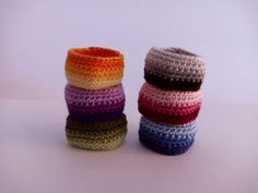 several crocheted items are stacked on top of each other