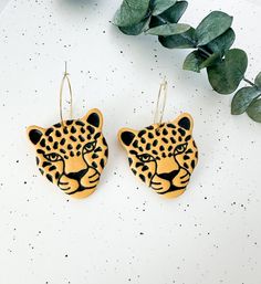 These unique leopard earrings are detailed by hand to have a dimensional, textured finish. The perfect touch for all of your boho outfits! Earrings measure approximately 2 inches in length and 1.25 inches in width and are lightweight. Hand sculpted polymer clay earrings, crafted delicately and finished with attention to detail. Hypoallergenic nickel-free posts, hoops, hooks, and silicone backs are used on all pieces.  Due to their handmade nature, colors and textures will vary slightly with each Leopard Print Drop Earrings Gift, Leopard Print Earrings For Pierced Ears As Gift, Leopard Print Earrings For Gift, Handmade Leopard Print Earrings, Leopard Earrings, Nature Colors, Earrings Colorful, Clay Jewellery, Painted Leaves