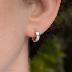 These small sterling silver hoop earrings are hand hammered, one pair at a time by me in the Beautiful Pacific Northwest of North America.SIZE: 12mm exterior diameter, 9mm interior, 3mm wide. and 1.5mm thick.Solid sterling silver posts and backs.I strive to run an environmentally sustainable business.Because my jewelry is made using hand fabrication processes, it has lightness, durability and detail unachievable via mass production.Read more about me and my beautiful tiny shop here: https://www. Minimalist Hammered Huggie Jewelry, Anniversary Hammered Huggie Earrings, Minimalist Hammered Hoop Earrings For Anniversary, Hoop Earrings For Men, Mens Earrings Hoop, Hammered Earrings, Earrings For Men, Sterling Silver Hoop Earrings, Recycled Silver