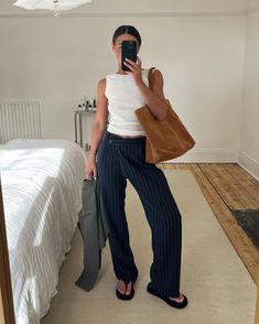 How to Wear Striped Trousers Like a Fashion Person | Who What Wear Blue Striped Pants Outfit, Navy Pants Outfit, Blue Pants Outfit, Zara Knit Top, Pants Outfit Work