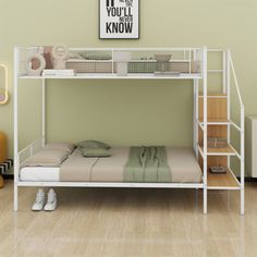 a white bunk bed sitting in a bedroom next to a dresser and lamp on top of a hard wood floor