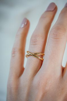 A new take on a classic style! The Infinity X-Ring is what happens when we merge the X-Ring and the Infinity Spiral Ring! To make this style, we wrap a length of thick, D-shaped metal to create a simple criss-cross 'X' design before soldering it securely on the back. ONE SINGLE Ring in SOLID 14K GOLD or ROSE GOLD SMOOTH, ROUNDED FINISH EXTRA THICK, 2 mm metal Every piece is organic and unique -- no two rings are exactly alike. * * * * * * * * * * * * * * * * * * * * * * * See a full description No Stone Gold Ring, Gold Rings Design For Female, Solid Gold Rings Unique, Infinity Gold Ring, Gold Ring Designs Unique, Modern Twist Wide Band Jewelry Gift, Modern Twist Wide Band Jewelry As Gift, Gold Rings With Modern Twist And Wide Band, 2 Finger Ring Gold