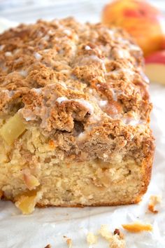 cinnamon apple bread with streusel topping and glaze on the top is shown