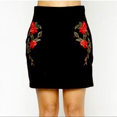 This Is A Super Stylish And Trendy Mini Skirt. The Skirt Is All Black And Has Beautiful Floral Embroidery On Both Sides Of The Front. It Features An Elastic Waistband Which Allows For A Really Nice Fit. The Material Is Very Stretchy And Is Meant To Have A Tight Look. Measurements Are Listed Below And Are In Inches. Measurements Are Approximate And In The Order Of Waist, Hip, And Length S - 14 / 17 / 18 M - 15 / 18 / 18 L - 16 / 19 / 19 Floral Embroidered Fitted Mini Skirt, Black Skirt With Floral Embroidery, Black Floral Embroidered Skirt, Fitted Embroidered Mini Skirt, Fitted Embroidered Black Mini Skirt, Embroidered Black Mini Skirt For Spring, Chic Black Skirt With Floral Embroidery, Chic Embroidered Black Skirt, Fitted Red Skirt With Floral Embroidery