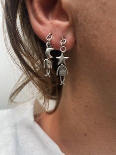 This set includes  1 MOON MAN earring 1 STAR MAN earring  Fallen from the galaxies above--these lively little figures have quite the personality! A pair of storytellers weaving tales of how we're all woven from stardust. Handcrafted with a galactic design these earrings capture the magic of the cosmos. SOLID STERLING SILVER HANDCRAFTED WITH LOVE Dope Jewelry, Funky Jewelry, Jewelry Lookbook, Men Earrings, Dream Jewelry, Jewelry Inspo, Fashion Aesthetic, Ear Jewelry, Pretty Jewellery