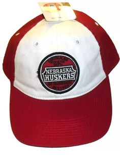 Brand New with Tags Nebraska Huskers Mens Adjustable strapback hat. The front has the embroidered Nebraska Huskers Est. 1869 logo on it. The back of hat has the adjustable strapback strap on it. Made of cotton material. It is made by Drew Pearson. Red Snapback Trucker Hat With Logo Patch, Red Snapback Hat With Logo Patch, Nebraska Huskers Volleyball, Nebraska Sweatshirt, Nebraska Huskers, Strapback Hats, Nebraska, Cotton Material, Trucker Cap