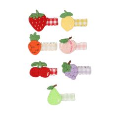 an assortment of fruit and vegetable hair clips