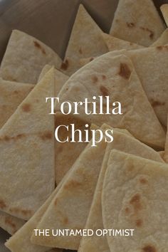 tortilla chips in a metal bowl with the words tortilla chips on it