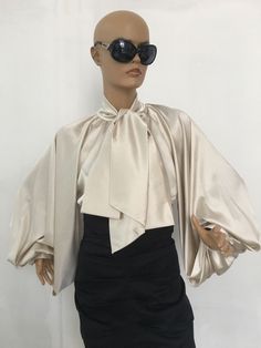 "This is a very stylish Womens Silk satin Blouse. It is comfortable and cozy. Made for a free flowing fit. Great for all year around and for any special occasion or casual day can be dressed up or dressed down. SIZE CHART SIZE S - US 6, UK 8, EU 36 bust: bust around 34.5\"/90cm Waist: waist around 27.5\"/70cm Hips: hips around 34.5\"/90cm SIZE M - US 8, UK 10, EU 38 bust: bust around 37.5\"/95cm Waist: waist around 29.5\"/75cm Hips: hips around 37.5\"/95cm SIZE L - US 10, UK 12, EU 40 bust: bust Elegant Party Top With Bow, Feminine Party Blouse With Bow, Elegant Silk Tops With Bow Detail, Elegant Silk Tops With Bow, Elegant Spring Tops With Satin Bow, Silk Formal Tops With Bow Detail, Elegant Tops With Satin Bow For Spring, Elegant Summer Blouse With Bow, Elegant Beige Silk Blouse