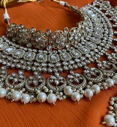 This bridal set comes in a gorgeous white beads and bronze gold plating. The set is lightweight and can easily be worn separately for a lighter and simple look. The finishing is done in gold and is completely handmade with intricate work. Only one piece in stock! Polki Necklace, Bridal Choker, Pearl Bridal Jewelry, Pakistani Wedding, Bridal Pearls, White Beads, Bridal Sets, Pearl White, Bridal Jewelry