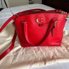 Beautiful Brand New Without Tags Coach Bag. Has A Removable Crossbody Strap, And Handles. Top Zip With Interior Slash Pockets And Zip Pocket. Two Full Size Pockets With Magnetic Closure. Perfect Condition. Red Leather Satchel With Branded Hardware, Chic Red Satchel With Textured Leather, Red Pebbled Leather Bag For Everyday Use, Chic Red Textured Leather Satchel, Luxury Red Pebbled Leather Bag, Red Leather Bag With Branded Hardware, Bags Coach, Coach Bag, Leather Satchel