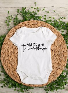 Made to Worship baby bodysuit or toddler t-shirt - This is a perfect baby shower gift *Bodysuits are Carter's brand. Please see their sizing chart if you aren't sure what size to order. *All bodysuits are white. The color you choose is for the text/image.  *If you would like a colored bodysuit, please request a custom order and we can see if we can meet your needs. Please note though that there is usually an added charge for this. *Each design is professionally cut and heat pressed to the bodysu Family Matching Short Sleeve Onesie For First Birthday, Unisex Short Sleeve Onesie For First Birthday, Cute Short Sleeve Onesie For Mother's Day, Cotton Onesie For Baptism, Cute Mother's Day Onesie With Short Sleeves, Cotton Short Sleeve Onesie For First Birthday, First Birthday Short Sleeve Onesie, White Short Sleeve Onesie For First Birthday, Mother's Day Cute Short Sleeve Onesie