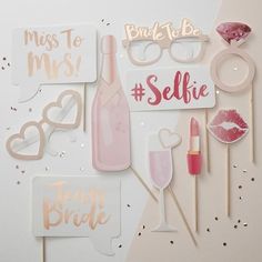 pink and gold photo booth props with confetti, lipstick, glasses, lips