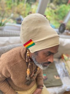 Original easy rastaman turban. Wrap up your locks pull on a Rasta durag ( optional,we also make and sell ) and pull on this comfortable double layered turban. Get the look original Rasta creation sizzla Kalonji rastaman bobodread turban This tam is in original khaki, wear with your gideon suit and you good to go  You can choose to represent with a little bit of rastafari colours if you want as that is optional Comes in 3 sizes going by the length of your locs. Up to shoulder length locs you can Casual Beanie-style Turban, One Size, Casual Beanie Turban, One Size Fits Most, Shoulder Length Locs, Sizzla Kalonji, Rasta Hat, Turban Wrap, Wooden Bead Necklaces, Popular Hairstyles, Hair Accessories Headbands