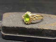 ARTSMYRNA METAL: 925k Silver GEM: Natural Peridot COATING: 24k gold over (We can made a special type of coating for your personal preference ) MATERIEL : 925K Sterling Silver ( Some of my items vermeil gold over silver for looks rich . But i can finish in silver too ) PAYMENT : We accept paypal payment RING SIZE: 6 (your desired size is made) GEM FEATURES AND BENEFITS Benefits: Perfecting communication with the environment. It removes jealousy, egoism and emotional coolness. It directs the perso Handmade Oval Yellow Gold Stackable Rings, Handmade Yellow Gold Rings For May Birthstone, Handmade Elegant Peridot Rings, Handmade 14k Gold Rings For May Birthstone, Elegant Handmade Peridot Rings, Handmade Peridot Wedding Rings, Heirloom Peridot Ring For Gift, Heirloom Peridot Ring As Gift, Heirloom Peridot Ring Gift