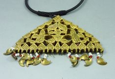 Old pendant from Kashmir made with glass beads set in gilded brass. This type of jewellery is a humble imitation of the Mughal style gold and gemstone jewellery. Small brass pendants in mango shape and translucent glass beads are hanging from the pendant. A few glass beads and mango pendants are missing. From mid XXth Century or older. This is an old and worn item. The pendant is 8,5 cm high with the hanging pendants (3,34 in) and 9,5 cm wide (3,74 in). The black cord is adaptable in size with a Kashmiri Jewellery, Ceremonial Meenakari Pendant Jewelry, Kashmiri Jewellery Vintage, Ornate Meenakari Pendant Jewelry, Ceremonial Meenakari Temple Necklace, Belly Dance Jewelry, Brass Pendants, Dance Jewelry, Translucent Glass